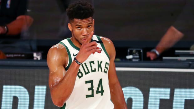 Giannis checks into NBA playoff game for the Milwaukee Bucks.